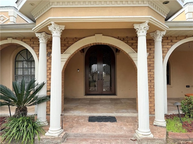 property entrance featuring french doors