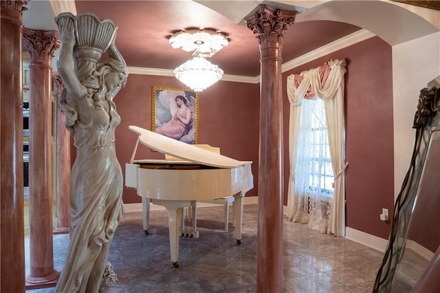 miscellaneous room with a chandelier, ornamental molding, dark tile floors, and decorative columns