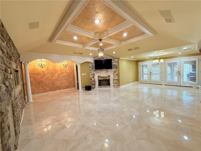 unfurnished living room with crown molding, arched walkways, coffered ceiling, and decorative columns