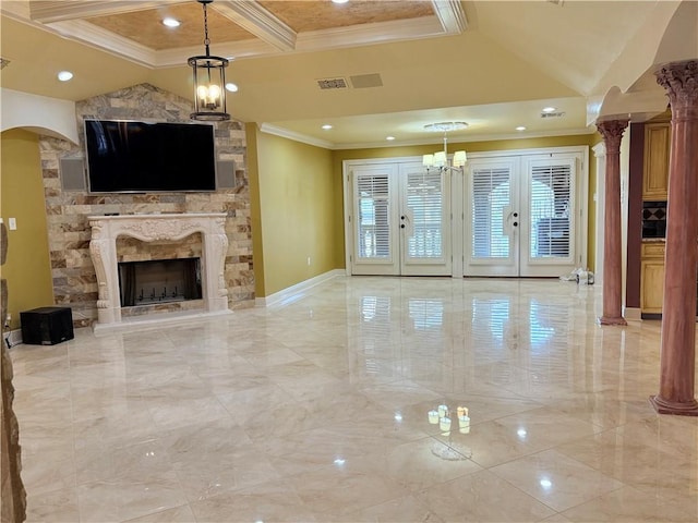 unfurnished living room with arched walkways, french doors, ornamental molding, a stone fireplace, and coffered ceiling