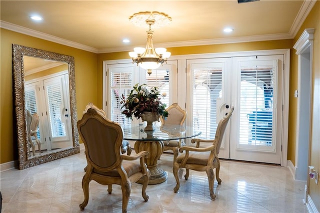 tiled dining area featuring a notable chandelier and ornamental molding