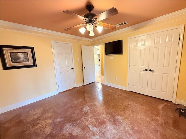 unfurnished bedroom with concrete floors, visible vents, crown molding, and baseboards