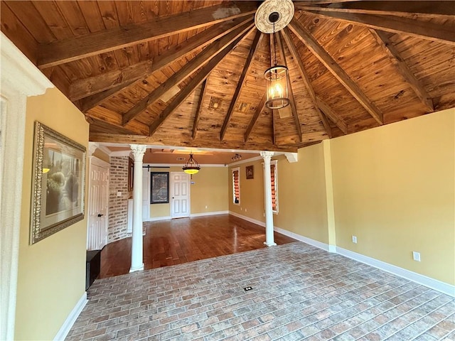 spare room with wooden ceiling, decorative columns, and baseboards