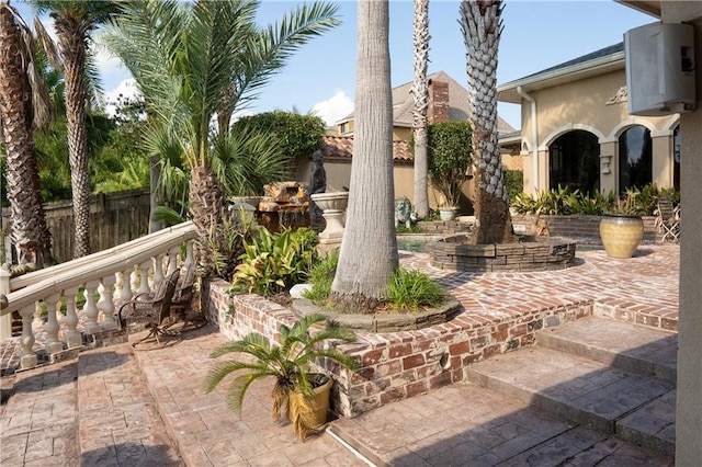 view of patio featuring fence