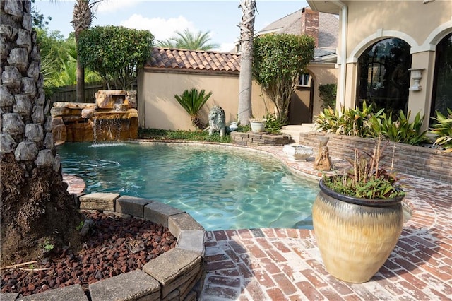 view of pool featuring pool water feature