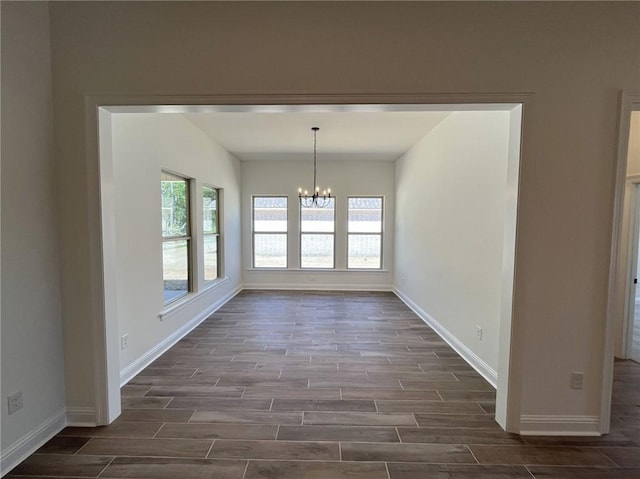 interior space with an inviting chandelier and dark wood-type flooring