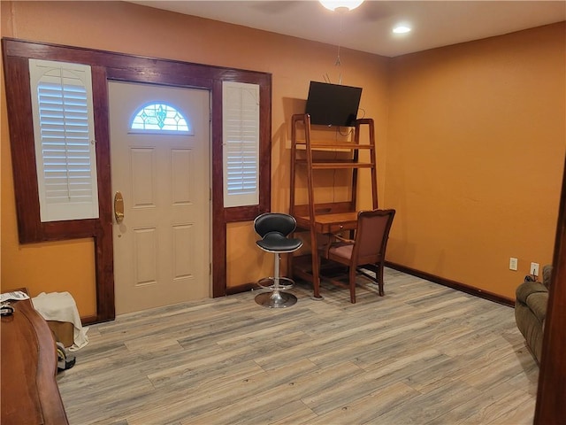 entrance foyer with light hardwood / wood-style floors and ceiling fan