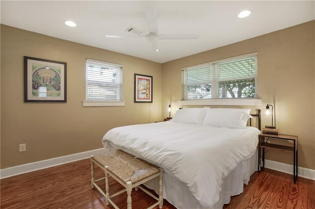 bedroom featuring dark wood-type flooring and ceiling fan