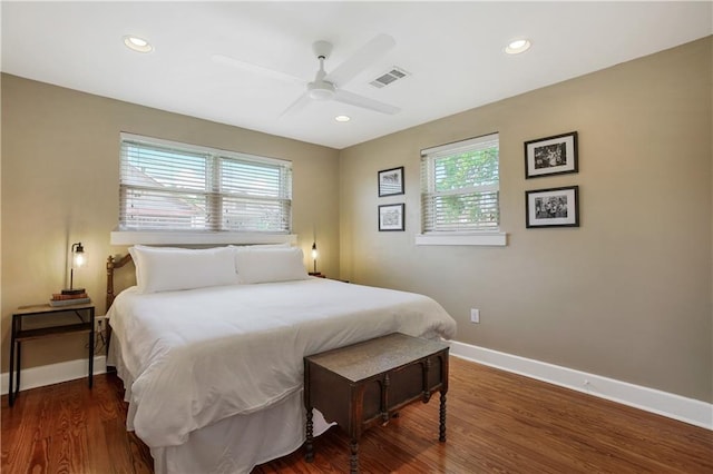 bedroom featuring dark hardwood / wood-style flooring and ceiling fan