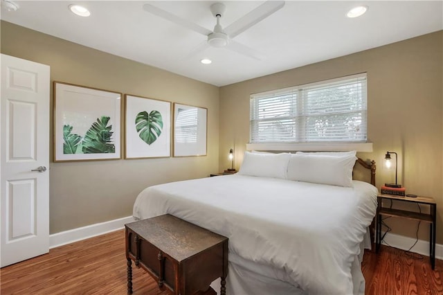 bedroom featuring ceiling fan and dark wood-type flooring