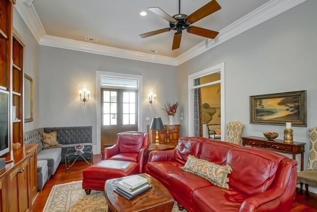 living room with wood-type flooring, french doors, ceiling fan, and ornamental molding