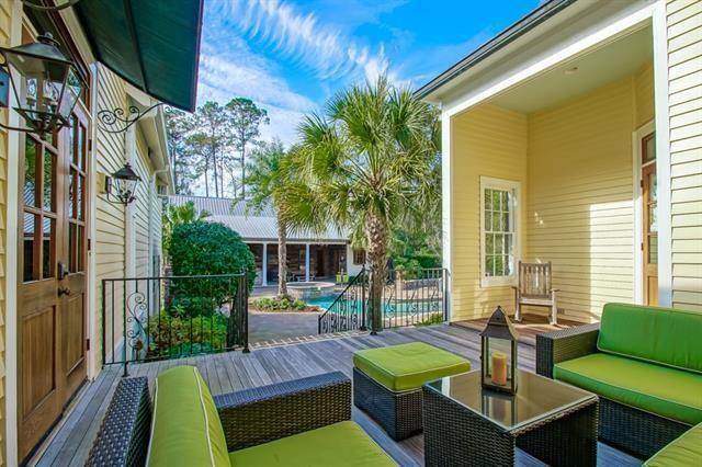 exterior space featuring an outdoor hangout area and a fenced in pool