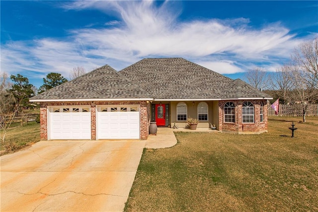 single story home with a front yard and a garage