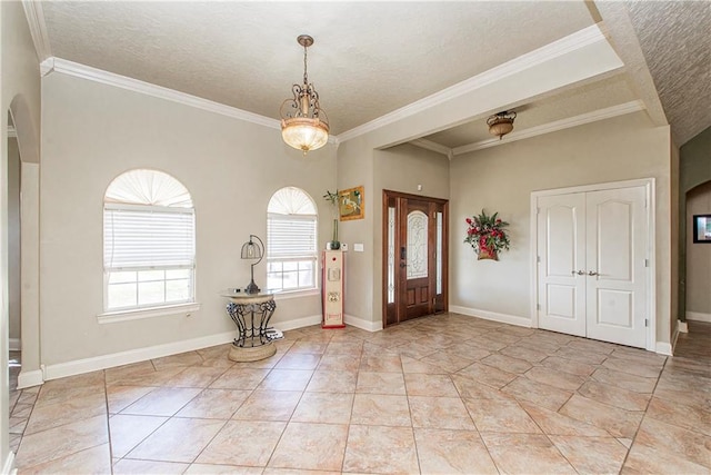 entrance foyer with crown molding, light tile floors, and a textured ceiling