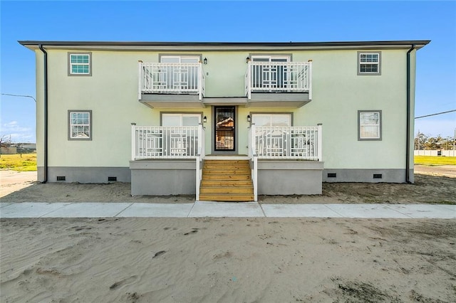 rear view of house with a balcony