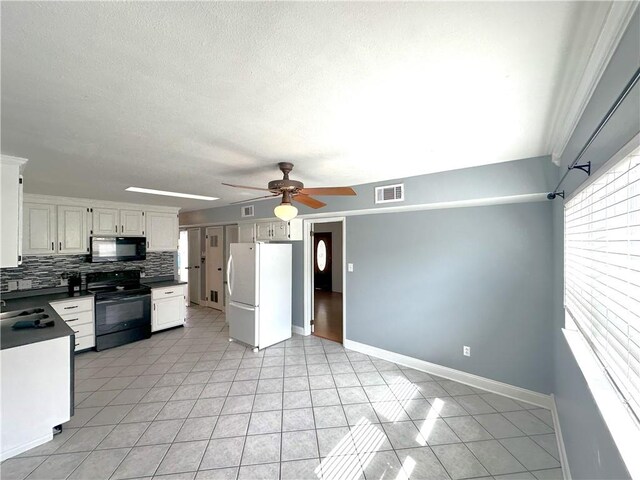 kitchen featuring ceiling fan, black appliances, backsplash, light tile floors, and white cabinetry