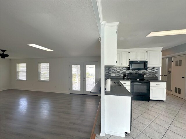 kitchen featuring french doors, black appliances, white cabinets, tasteful backsplash, and light tile floors