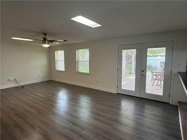 unfurnished room featuring french doors, dark hardwood / wood-style floors, and ceiling fan