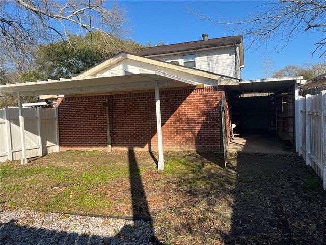 view of property exterior featuring a carport