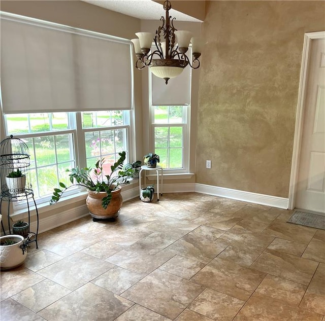 interior space featuring a notable chandelier and tile patterned floors