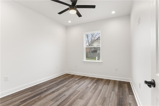 unfurnished room with ceiling fan and dark hardwood / wood-style floors