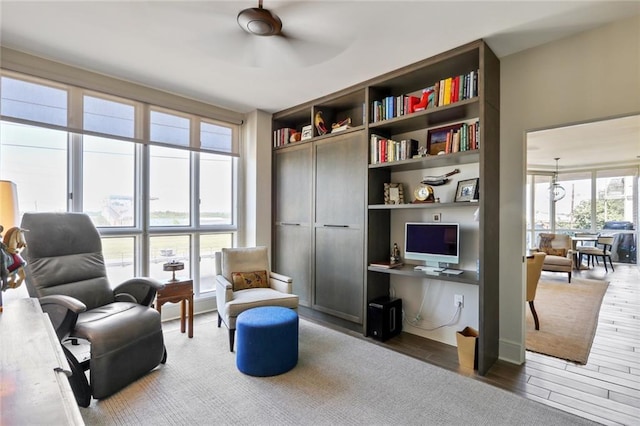 living area featuring ceiling fan