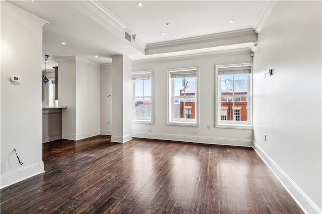 spare room featuring crown molding and dark hardwood / wood-style floors