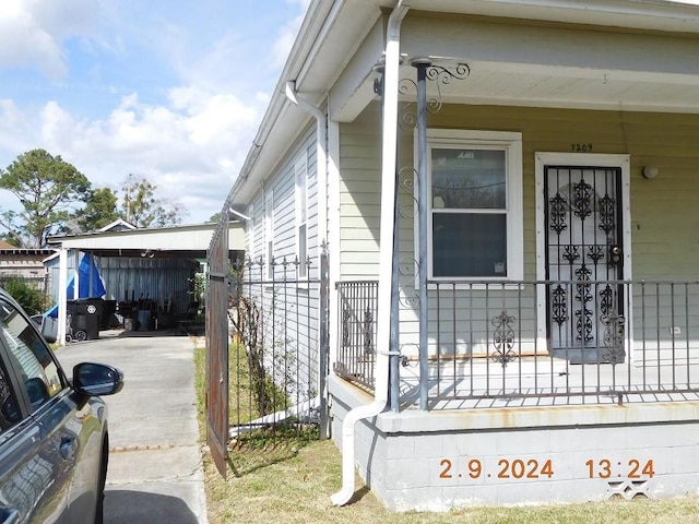 view of side of property with a porch