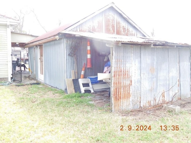 view of shed / structure with a lawn