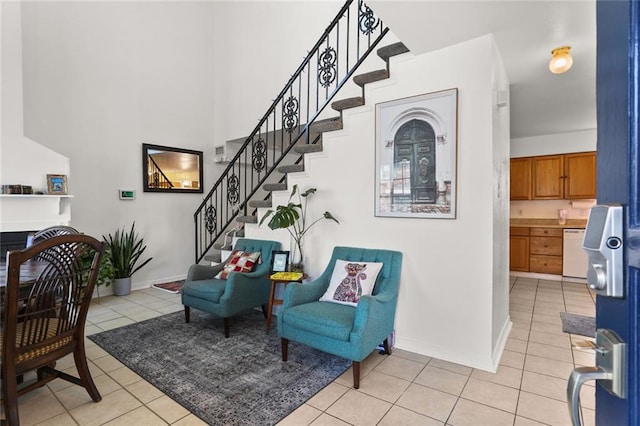 300-02 33rd St, New Orleans, LA 70124 - stairs with tile patterned floors, a fireplace, and a towering ceiling
