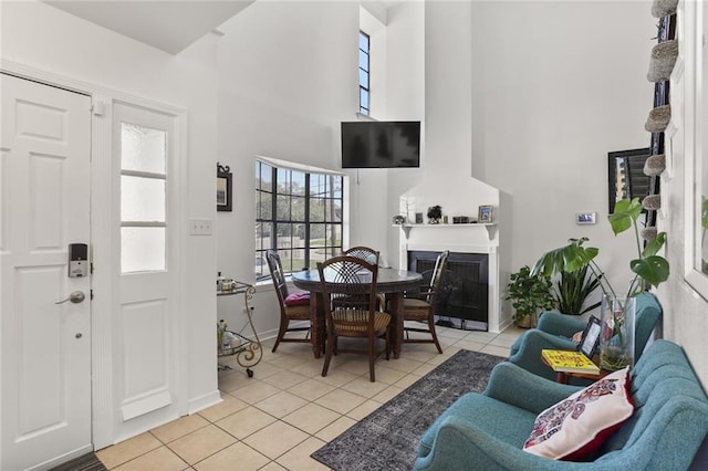 300-02 33rd St, New Orleans, LA 70124 - entrance foyer with a high ceiling, light tile patterned floors, and a fireplace with flush hearth
