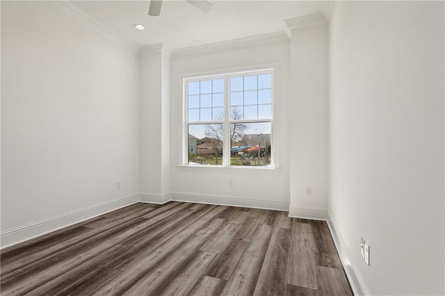 empty room featuring crown molding, ceiling fan, and dark hardwood / wood-style flooring