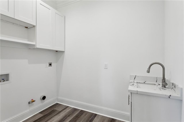 laundry area with dark hardwood / wood-style floors, hookup for an electric dryer, sink, cabinets, and gas dryer hookup