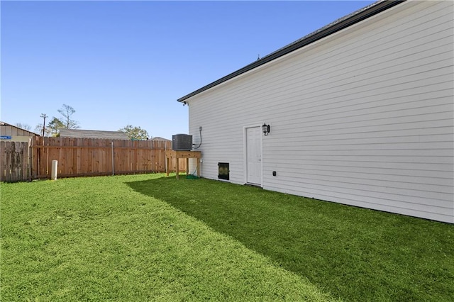 view of yard featuring central air condition unit