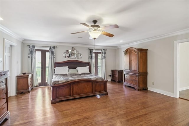 bedroom with dark hardwood / wood-style flooring, access to exterior, multiple windows, and french doors