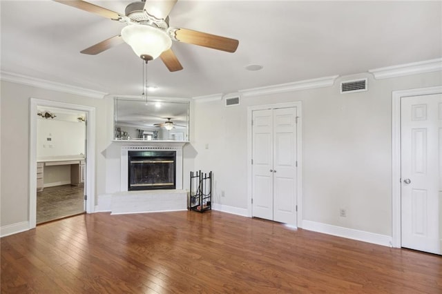 unfurnished living room featuring crown molding and wood-type flooring