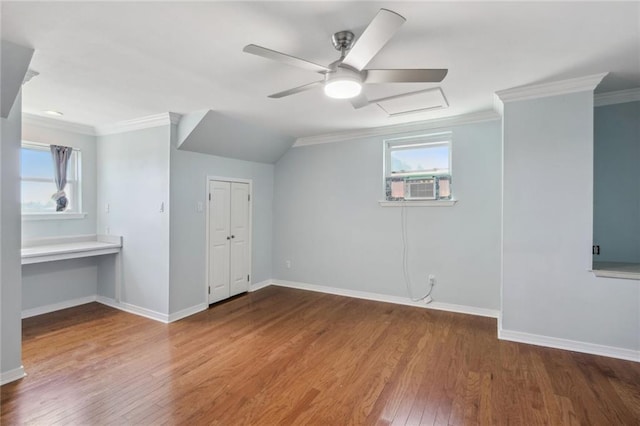 bonus room with cooling unit, wood-type flooring, ceiling fan, and plenty of natural light