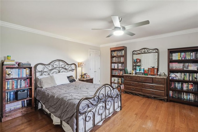 bedroom featuring ceiling fan, ornamental molding, and light hardwood / wood-style floors