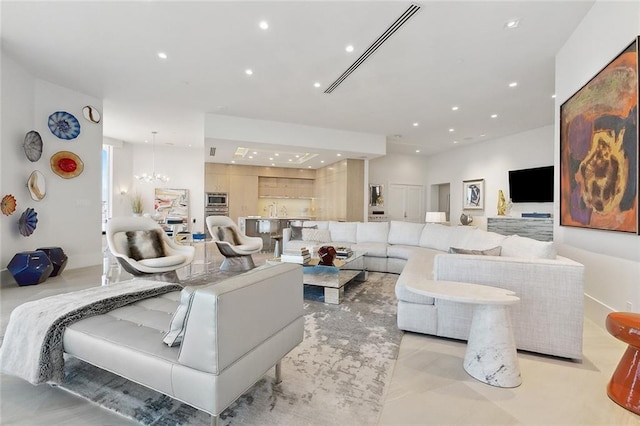 living room featuring a notable chandelier