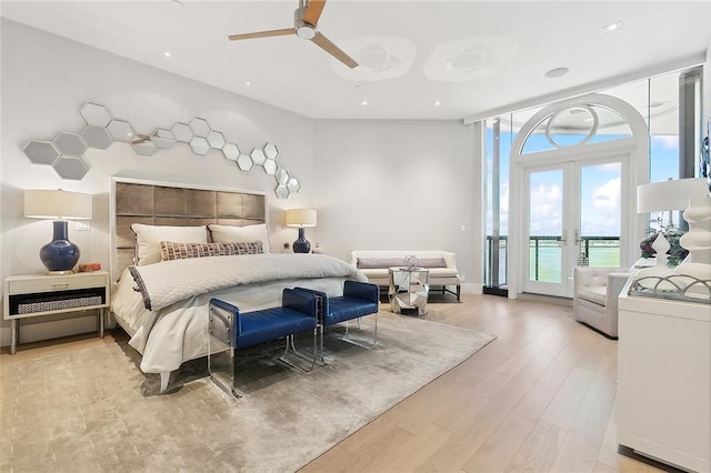 bedroom featuring light hardwood / wood-style flooring, access to exterior, ceiling fan, and french doors