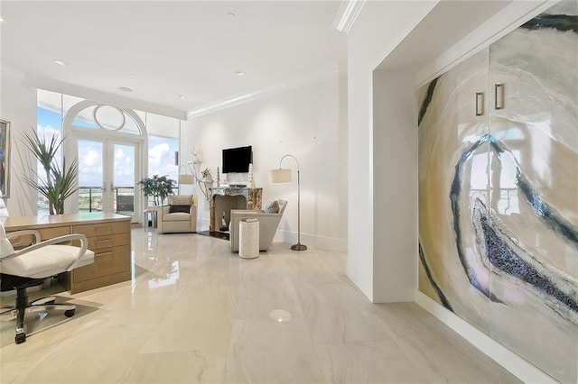 interior space with light tile floors, crown molding, and french doors