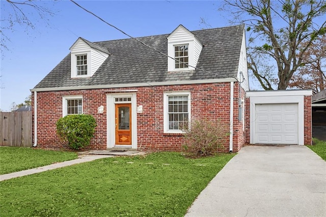 cape cod home with a front lawn and a garage