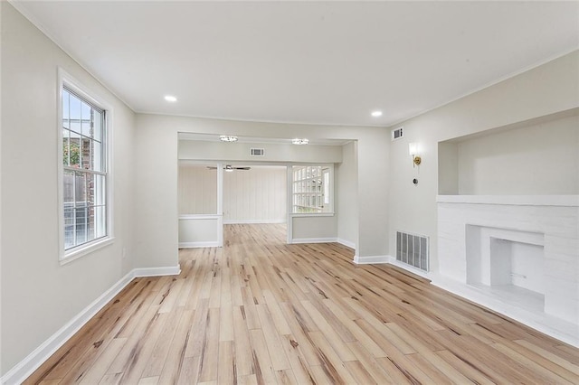 unfurnished living room featuring light hardwood / wood-style flooring