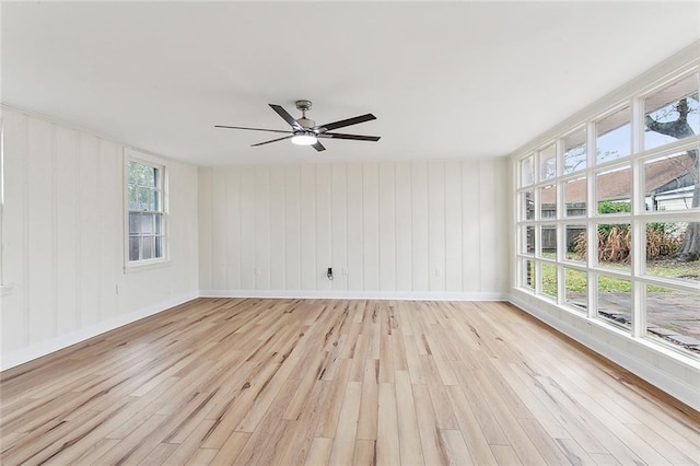 unfurnished room featuring ceiling fan and light hardwood / wood-style floors