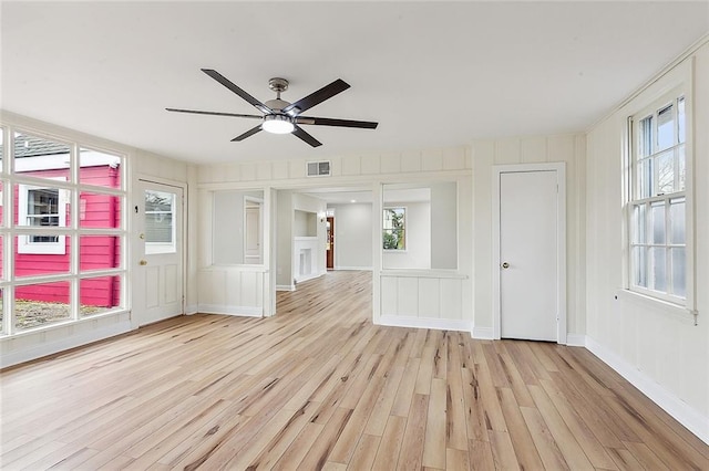 empty room featuring ceiling fan and light wood-type flooring