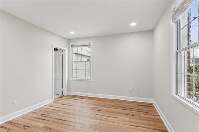 spare room featuring light hardwood / wood-style flooring