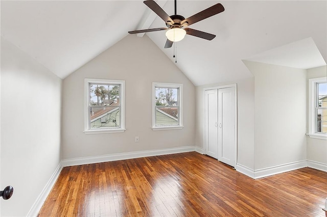 bonus room featuring vaulted ceiling, ceiling fan, and dark wood-type flooring