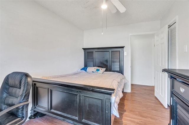 bedroom with wood-type flooring and ceiling fan