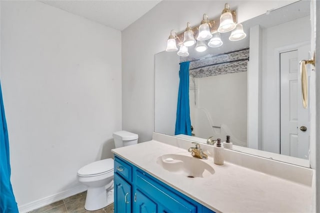 bathroom with toilet, vanity with extensive cabinet space, and tile flooring