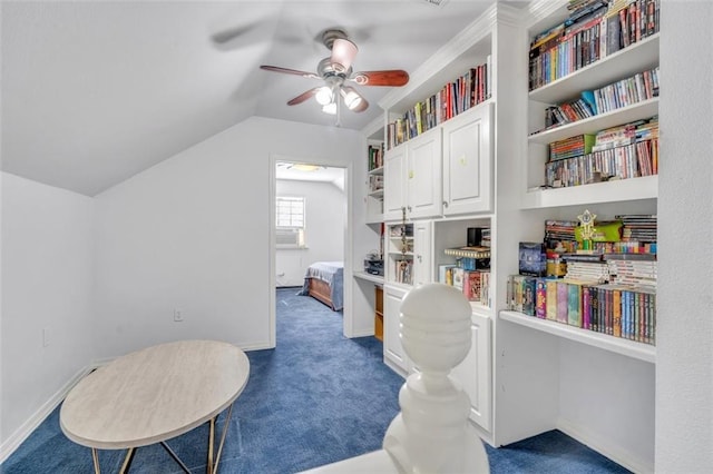 interior space with vaulted ceiling and ceiling fan